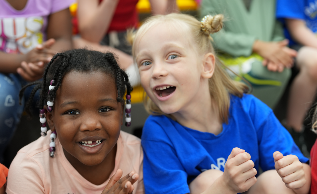 two girls smiling